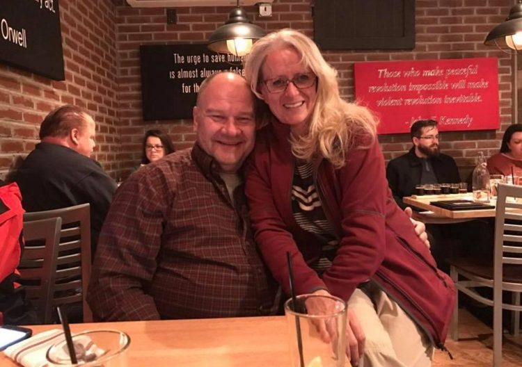 Mike Burns, shown with his ex-wife Kimberly Houle, was known as a devoted father and Boy Scout troop leader. He "was a lover, not a fighter," said Dean Rondeau, a friend who met Burns in college.