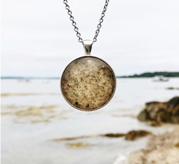 A Kate Clark pendant containing sand from the beach at Cushing Point on Long Island.