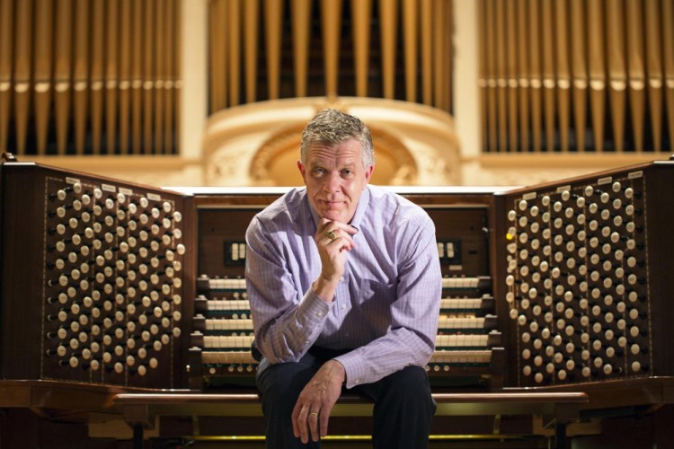 Municipal organist Ray Cornils at the Kotzschmar Organ at Merrill Auditorium in Portland. Cornils plans to retire at the end of this year.