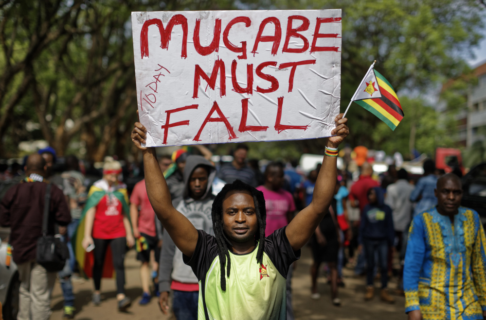 Protesters demanding that longtime President Robert Mugabe stand down march toward the State House in Harare, Zimbabwe, on Saturday.