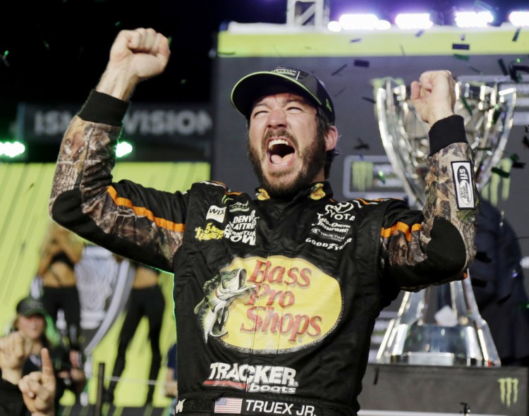 Martin Truex Jr. celebrates after his victory Sunday at Homestead-Miami Speedway in the Cup Series championship race. It was the eighth win of the year for Truex, who beat three former champions for the season title.