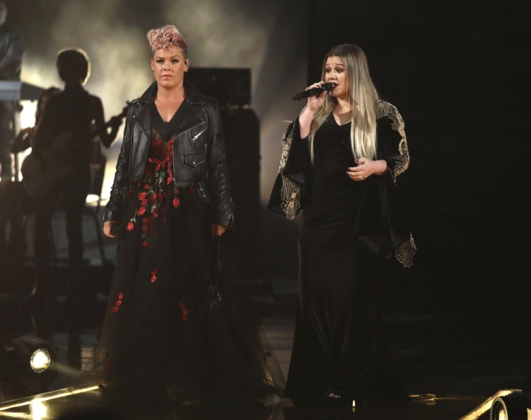 Pink, left, and Kelly Clarkson perform "Everybody Hurts" at the American Music Awards. (Photo by Matt Sayles/Invision/AP)