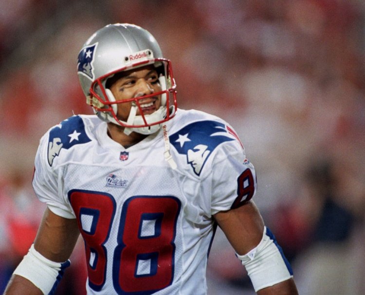 New England wide receiver Terry Glenn looks back after catching a touchdown pass from quarterback Drew Bledsoe against the Buccaneers in Tampa, Florida, in 1999. Officials say Glenn died following a one-vehicle rollover traffic accident near Dallas that left his fiancée slightly injured.