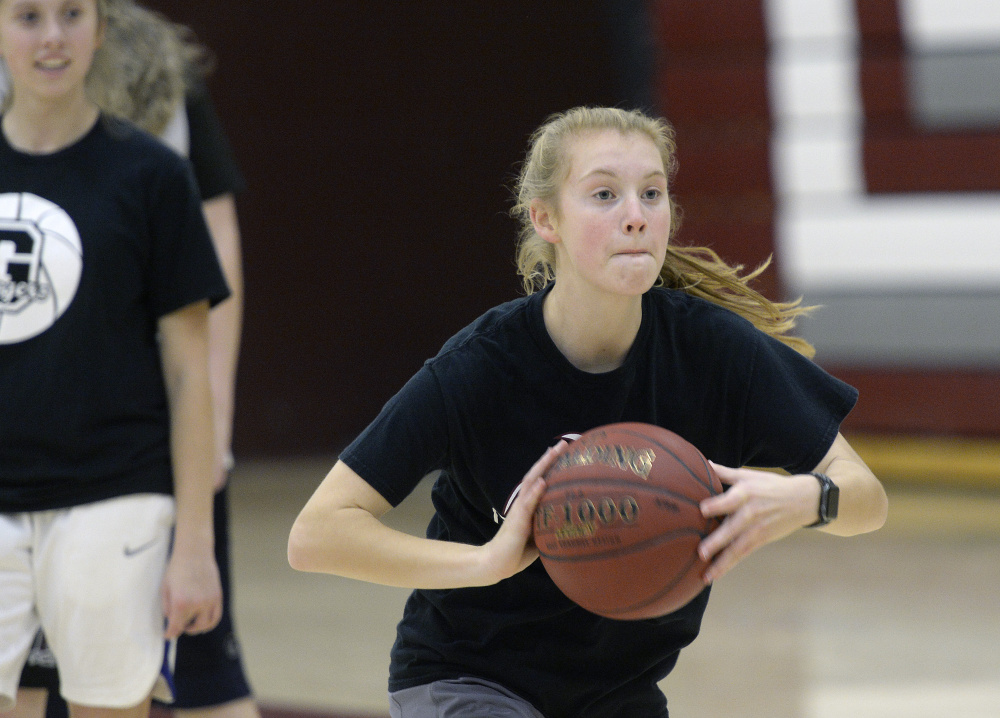 Anna DeWolfe, a two-time All-State player and one of two returning starters for Greely, makes a pass during her team's opening practice Monday.