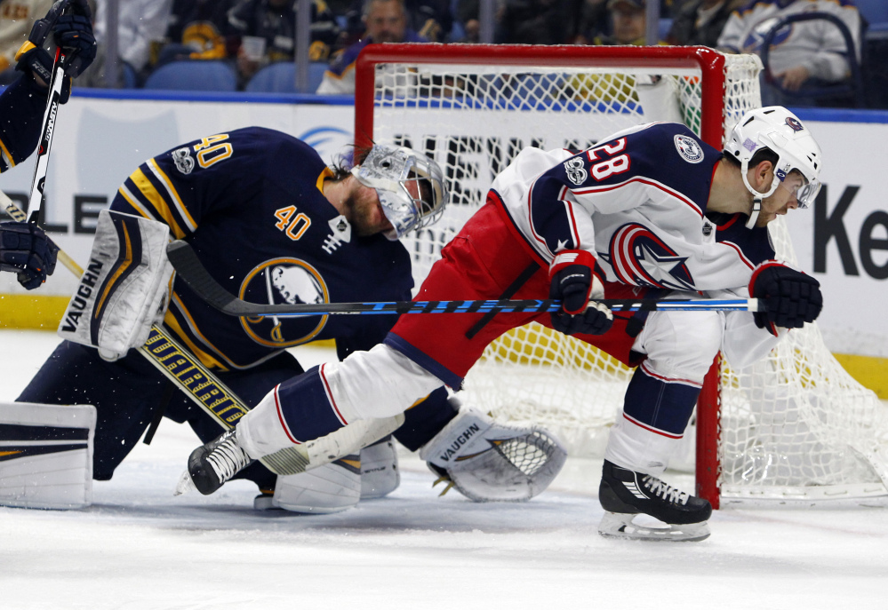 Buffalo Sabres goalie Robin Lehner and Columbus Blue Jackets forward Oliver Hannikainen collide in the crease during the second period of Monday's game, won by Columbus 3-2.