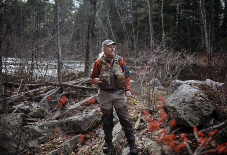 Evelyn King stands near the bank of the Prescumpscot River in Windham. King is the founder of the Maine Women Fly Fishers and is a big advocate for getting more women out in nature. "For me it's sharing that passion. I love the time I'm on the water and I want to help other people experience that," King said.
