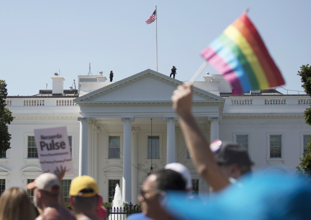 Equality March for Unity and Pride participants march past the White House in Washington in June. A second federal judge has halted the Trump administration's proposed transgender military ban.