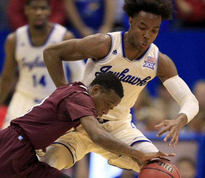 Demontrae Jefferson of Texas Southern attempts to get around Devonte' Graham of Kansas during the first half of Kansas' 114-71 victory Tuesday night.