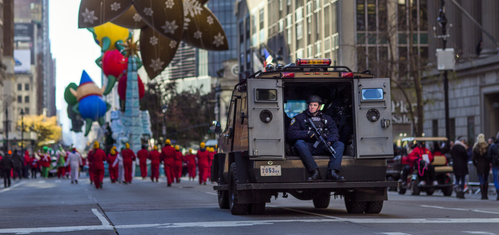 Heavily armed police patrol the parade route during the Thanksgiving Day parade in New York on Thursday.