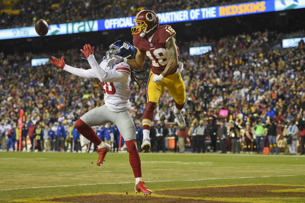 New York Giants cornerback Janoris Jenkins reaches for a pass intended for Washington wide receiver Josh Doctson during the first half in Landover, Md., on Thursday.