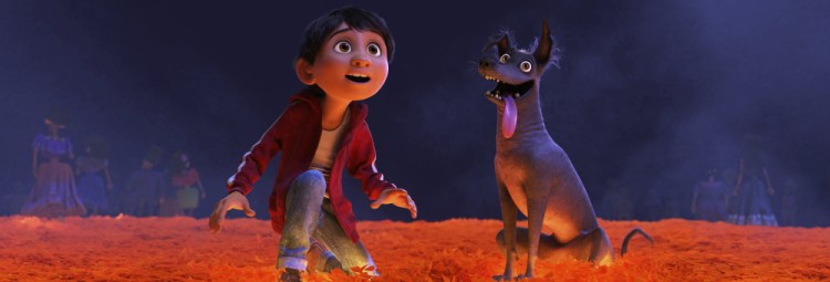 Miguel, voiced by Anthony Gonzalez, and Dante in a scene from "Coco."