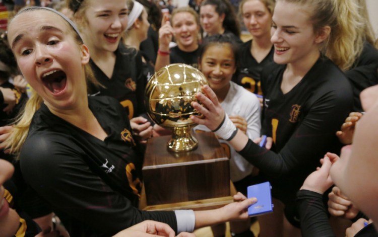 Megan Connelly, left, said more time was spent this season in the weight room and working on conditioning. It paid off when Cape Elizabeth captured a state volleyball championship.