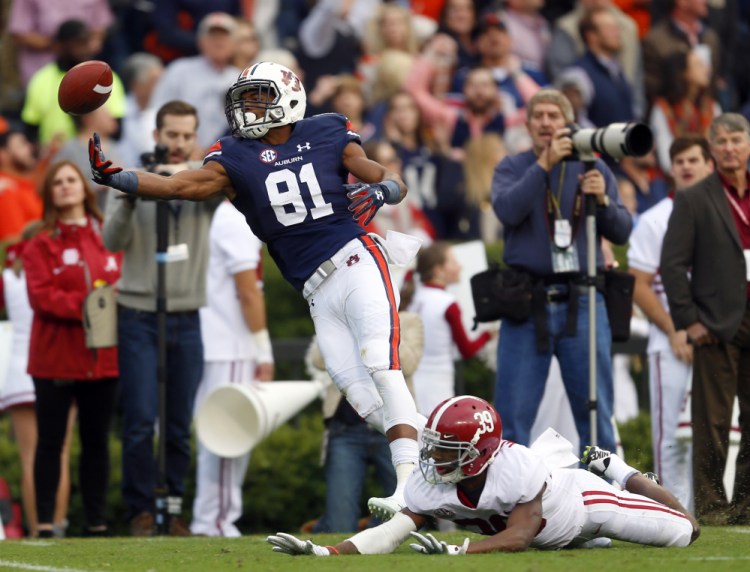 Auburn wide receiver Darius Slayton is unable to pull in a pass as Alabama defensive back Levi Wallace defends during the first half on Saturday in Auburn, Ala. The Tigers beat the Tide, 26-14.
