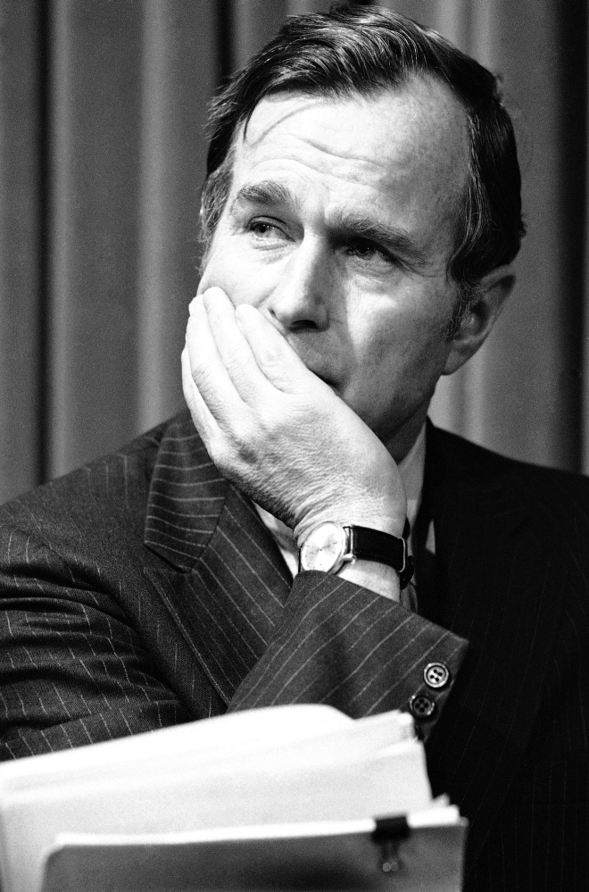 Former President George H.W. Bush is pictured in December 1975, long before his election to the White House. "This is hardly a sexual predator," says Mark Updegrove, author of a newly released book titled "The Last Republicans," about the relationship between Bush and his son George W. Bush. "This is a man who made an inappropriate gesture and a bad joke with women he didn't know well."