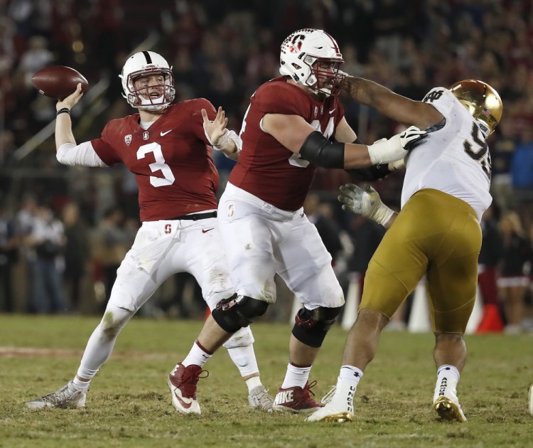 Stanford quarterback K.J. Costello throws a pass against Notre Dame during the second half Saturday night in Stanford, Calif. Stanford won 38-20.