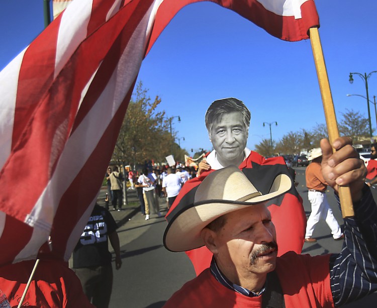 United Farm Workers supporters rally in Santa Rosa in April at the annual march for Cesar Chavez, pictured at center, the iconic labor leader who launched the farmworker union.