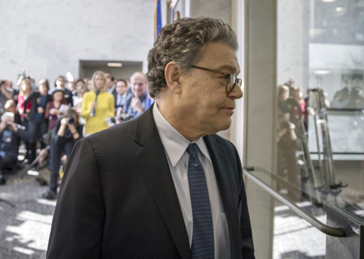 Sen. Al Franken, D-Minn., returns to his office after talking to the media on Capitol Hill on Monday. "I want to be someone who adds something to this conversation," he said.