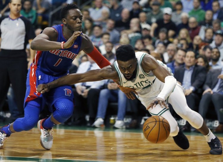 The Pistons' Reggie Jackson fouls Boston's Jaylen Brown on a play in the second quarter of Monday night's game in Boston.