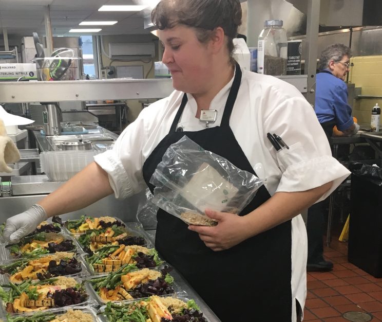Jessica Carroll, a cook at Waldo County General Hospital in Belfast, makes a grab-and-go Super Vegan Salad for the cafeteria. The salad sold out quickly and is one of the new plant-based dishes being served in hospitals across the state.