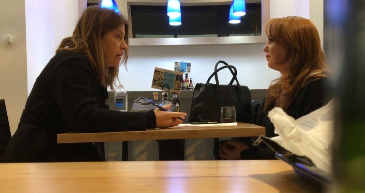 Washington Post reporter Stephanie McCrummen, left, questions a woman who appeared to be trying to trick the newspaper into publishing a story based on a false charge.