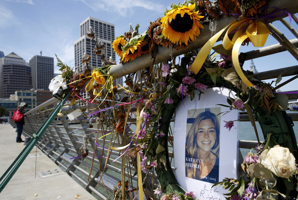 Flowers and a portrait of Kate Steinle formed a memorial on Pier 14 in San Francisco after her death in July of 2015.