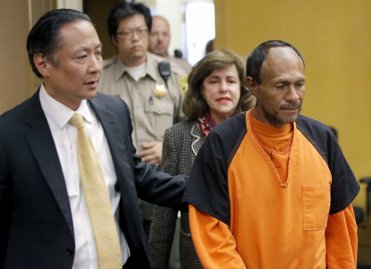 Jose Ines Garcia Zarate, right, is led into the courtroom by San Francisco Public Defender Jeff Adachi, left, and Assistant District Attorney Diana Garciaor for his arraignment on July 7, 2015. A jury acquitted him in November on possible charges ranging from involuntary manslaughter to first-degree murder.
