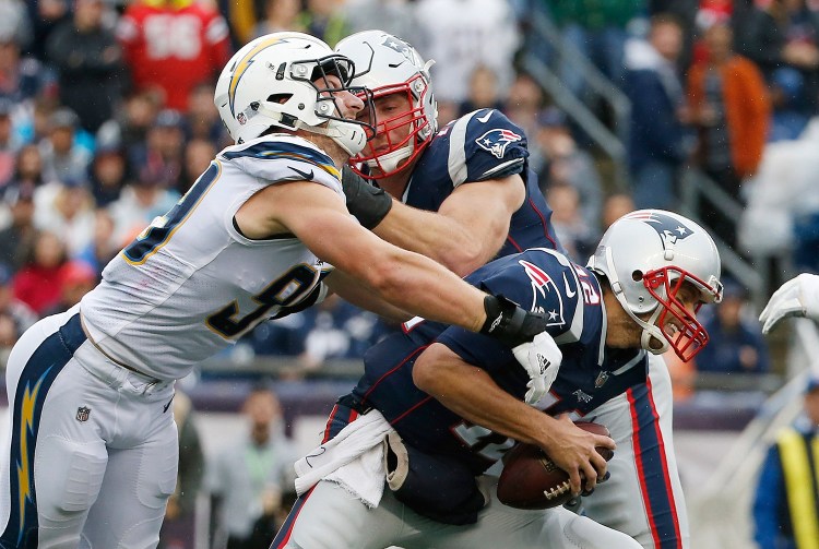 Patriots quarterback Tom Brady has remained healthy this season and led his team to a 6-2 start. He has, however, taken hits, like this one from San Diego’s Joey Bossa, and the Patriots can’t afford to lose him to an injury.