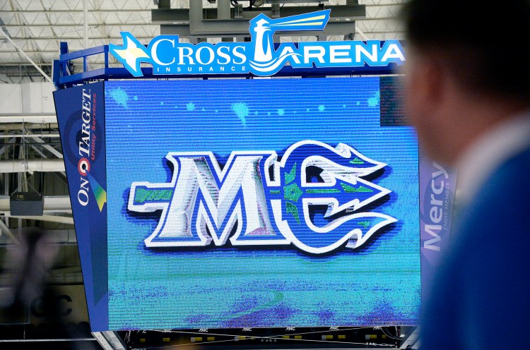 The Maine Mariners reveal their new logo Wednesday on the scoreboard at the Cross Insurance Arena in Portland. The logo's  horizontal trident forms the vowel in the abbreviation for Maine. 