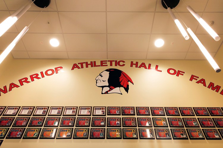 The foyer to Wells High School's athletic center prominently displays the school's mascot.