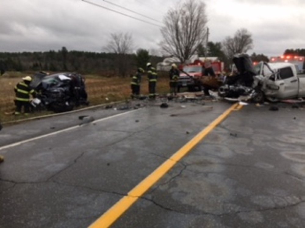 Norridgewock firefighters worked for two hours to extricate the driver of a Jeep Liberty, left, that had been hit head-on by a GMC pickup that crossed the centerline on Route 201A in Norridgewock.