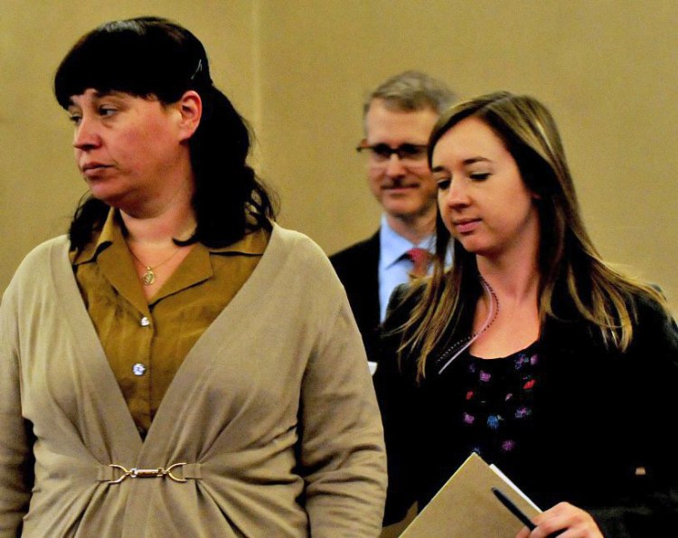 Miranda Hopkins, left, of Troy and her defense attorneys, Christopher MacLean and Laura Shaw, inside Waldo County Superior Court in Belfast for the start of her manslaughter trial in the death of her son last week.