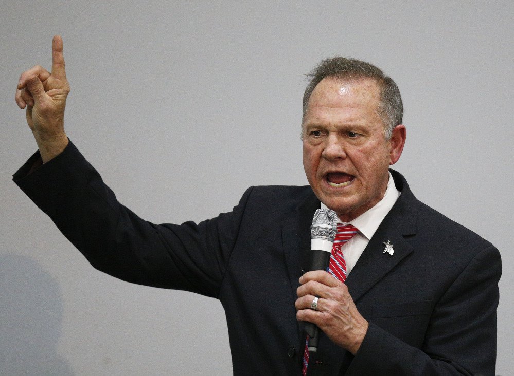 Former Alabama Chief Justice and U.S. Senate candidate Roy Moore speaks at a church revival Tuesday. U.S. Rep. Bruce Poliquin said Moore should drop out of the Senate race in Alabama if sexual harassment accusations against him are true.