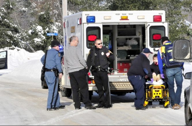 Edward Domasinsky is loaded into an ambulance with injuries to his face that police say were self inflicted following a domestic dispute with a woman at a residence on Horseback Road in Clinton on Jan. 5, 2014.