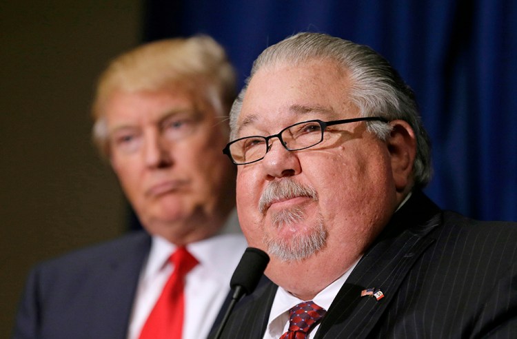 Sam Clovis speaks during a news conference as then-Republican presidential candidate Donald Trump in Dubuque, Iowa. 