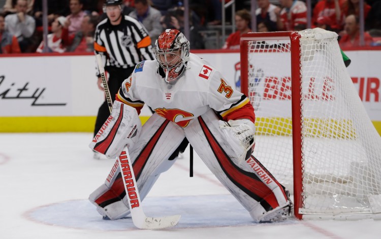 Calgary Flames goalie Jon Gillies of South Portland watches the play during the second period Wednesday night in Detroit.