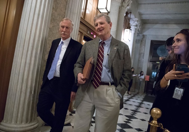 U.S. Sen. Angus King, I-Maine, left, and Sen. John Kennedy, R-La., arrive for votes on Capitol Hill in Washington on Monday. On Thursday, King tried to send the Republican tax plan back to a Senate committee, but his motion failed on a party-line vote.