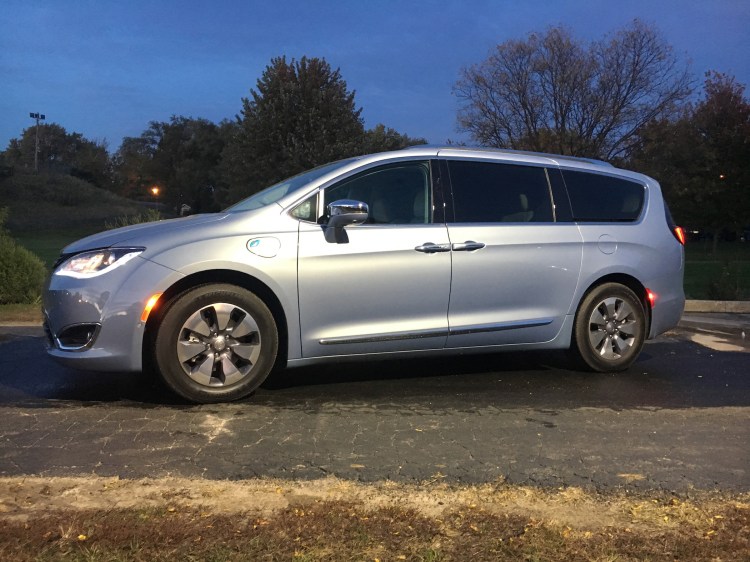 The 2017 Chrysler Pacifica plug-in hybrid minivan has a 33-mile electric range and total range of 566 miles when powered by the 3.6-liter V-6 engine. Pictured in Platinum trim.