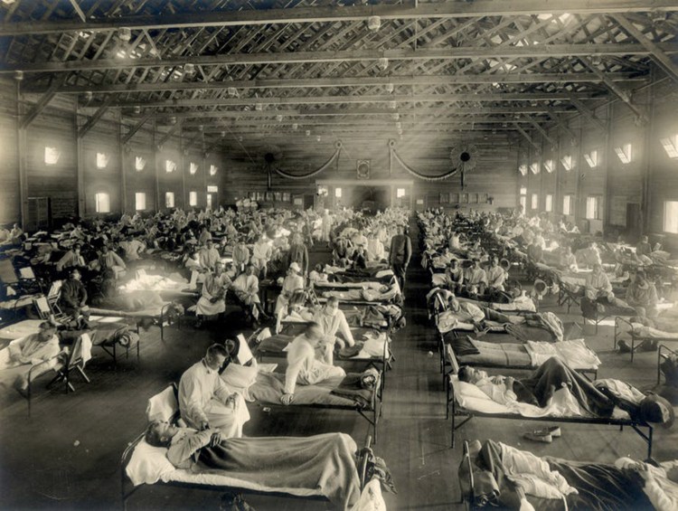 Patients fill beds in an emergency hospital in Camp Funston, Kansas, during the influenza epidemic around 1918. 