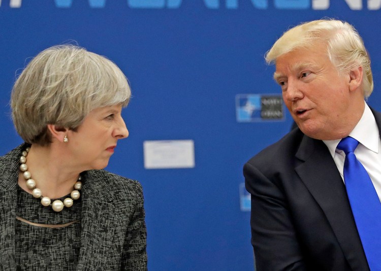 President Trump speaks with British Prime Minister Theresa May during a working dinner at the NATO  summit  in Brussels on May 25, 2017. 