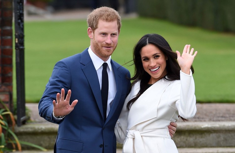 Britain's Prince Harry and Meghan Markle pose for the media on the grounds of Kensington Palace in London on Monday. It was announced that they will marry.