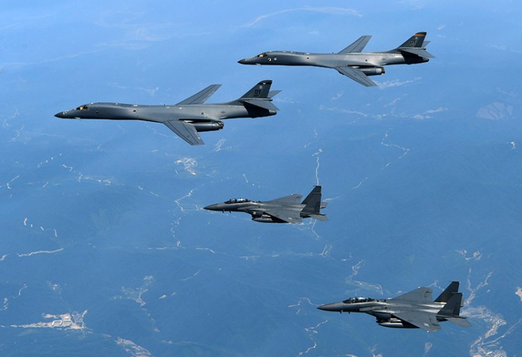 U.S. Air Force B-1B bombers, top, and second from top, and South Korean fighter jets F-15K fly over the Korean Peninsula, South Korea in June 2017. 