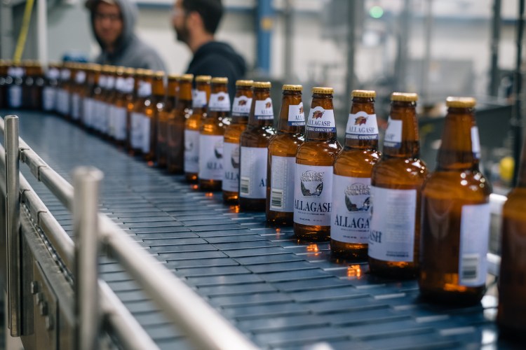 Bottles of Sixteen Counties roll down the line at Allagash.  Photo courtesy of Allagash