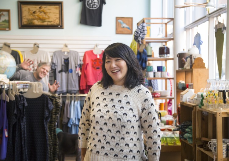 Amy Teh, one of the founders of Picnic, a craft show in Portland that showcases Maine makers. Popping out in the background is Noah DeFilippis, Teh's partner and another founder of Picnic.