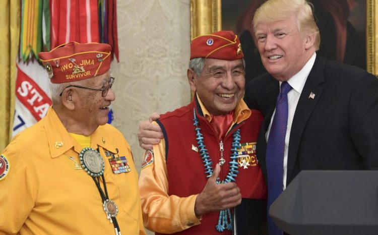 President Trump, right, meets with Navajo Code Talkers Peter MacDonald, center, and Thomas Begay, left, in the Oval Office of the White House. MacDonald said America's diversity makes us strong.