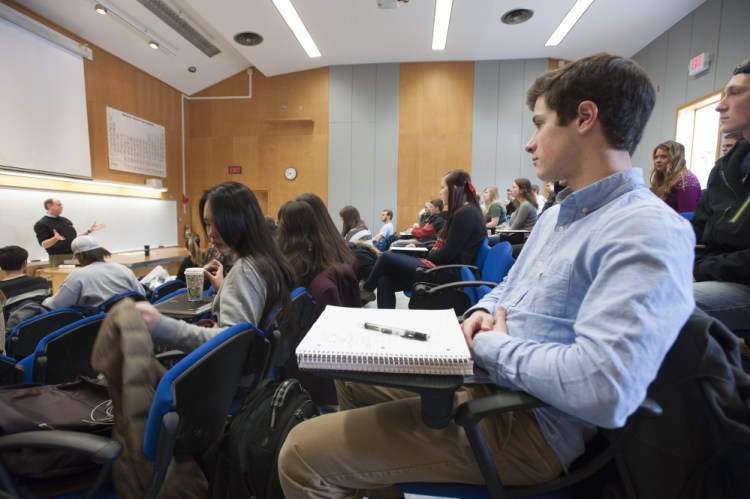 Students listen to a University of Maine macroeconomics lecture in 2015. Readers say a column pushing changes to the college system missed a couple points.