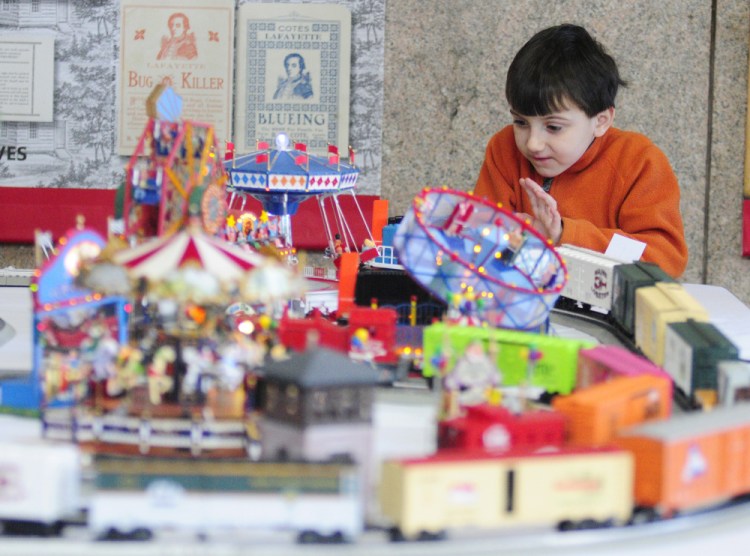 Nathan Davis, 5, of Palermo, watches model trains go by Friday during the annual display at the Maine State Museum in Augusta.