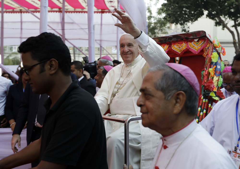 Associated Press/Andrew Medichini
Pope Francis arrives at an interfaith and ecumenical meeting for peace at the archbishop's residence in Dhaka, Bangladesh.