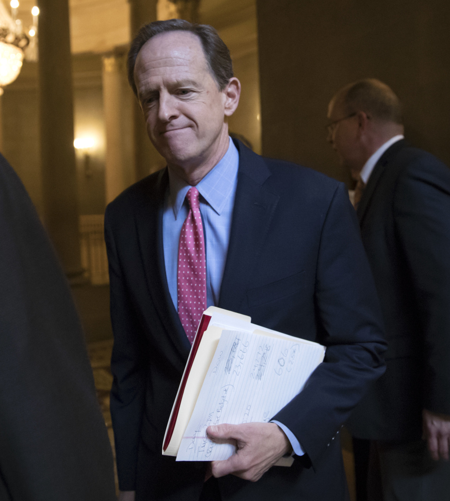 Sen. Pat Toomey, R-Pa., defended a tax break for Hillsdale College, which has a connection with the DeVos family.