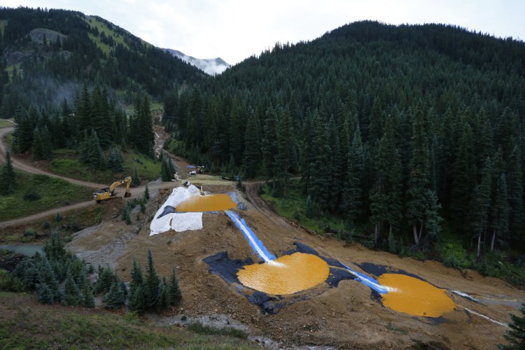 Water flows through a series of retention ponds built to contain and filter out heavy metals and chemicals from the Gold King mine chemical accident, in Silverton, Colo. 
