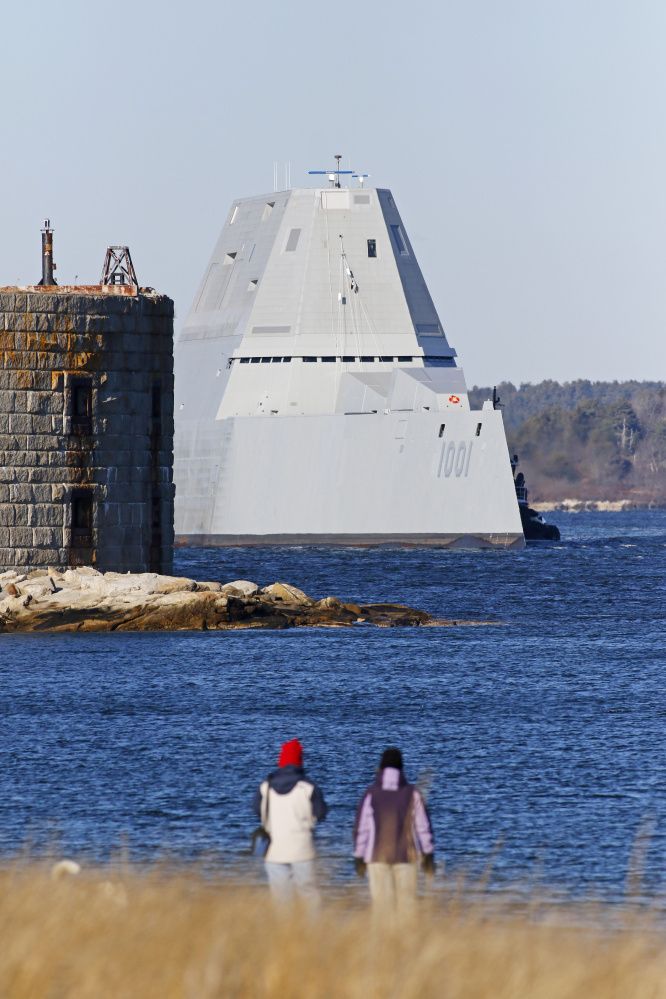 People watch as the newest Zumwalt-class stealth destroyer built by BIW passes Fort Popham as it takes a test run Monday down the Kennebec River in 2017.